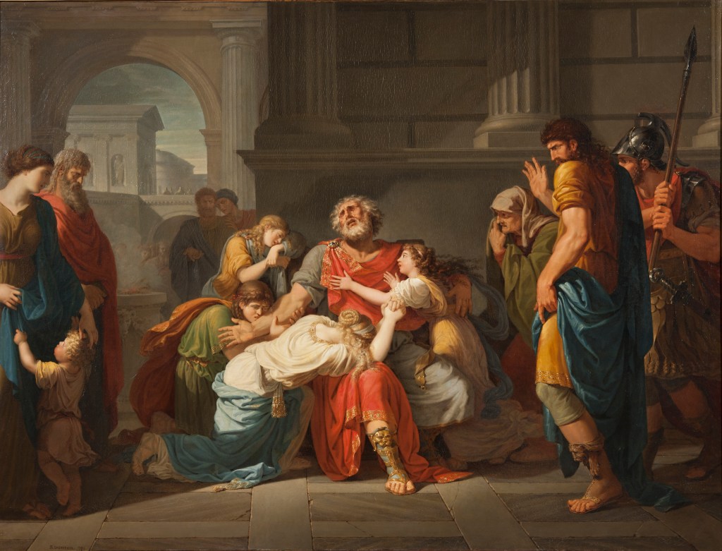 A neoclassical painting depicting the blind Oedipus seated at the center of a palace-like interior, surrounded by grieving children and attendants. His eyes are clouded and uplifted as figures cling to him in sorrow, while guards and onlookers stand nearby in shadow. The scene conveys grief, blindness, exile, and the tragic aftermath of revelation.